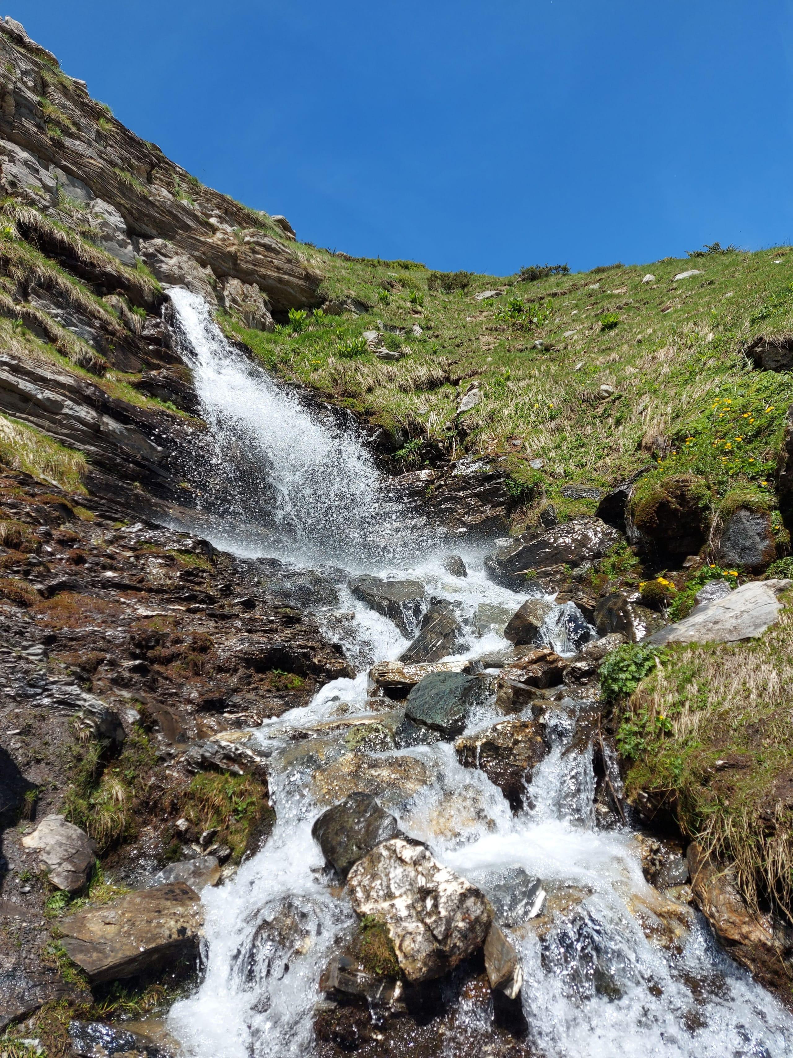 A close pass shows ice building outward from the rock face, not the water's edge.