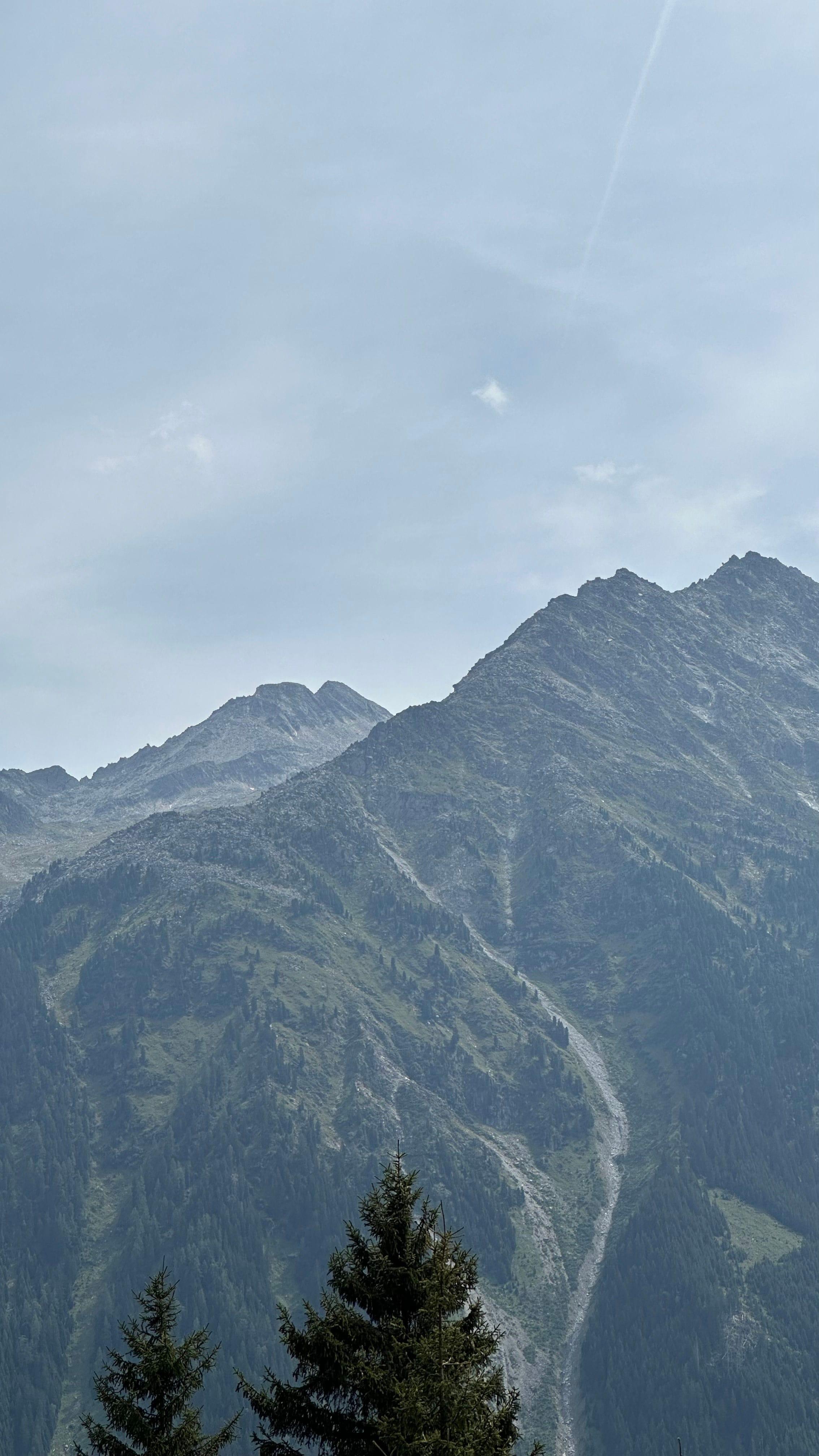 A majestic view of the Austrian Alps under a clear sky